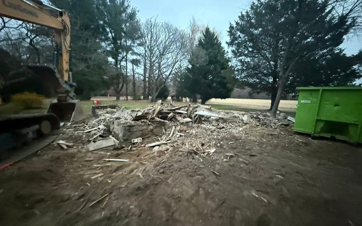 Broken foundation rubble on a cleared demolition site